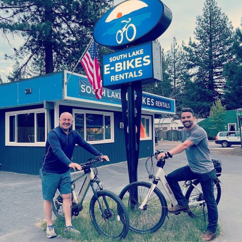 Owners in front of building